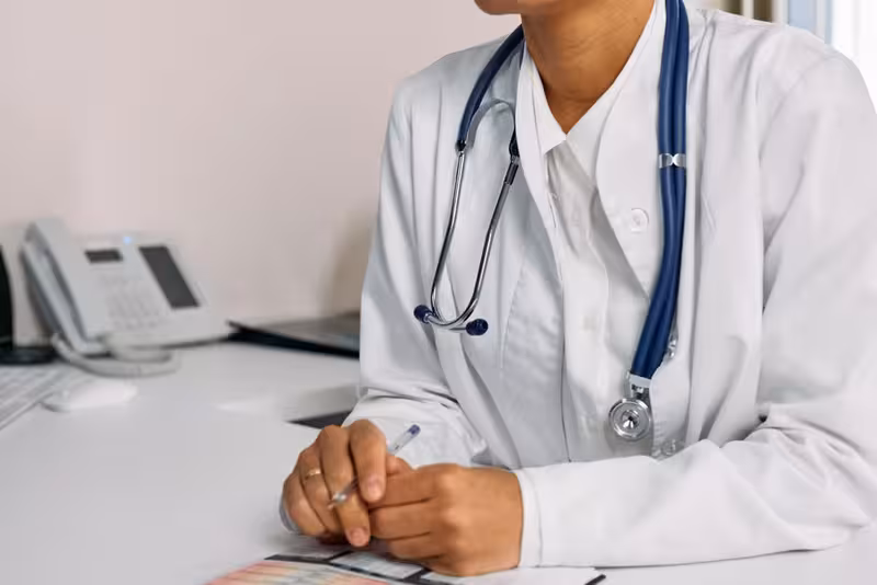 Blue Badge Parking Arrangements: A doctor in a clinic Doctor in clinic for Blue Badge Parking Arrangements - Taxi Drop-Off Point For Finchley: Private Microsuction Ear Wax Remova...