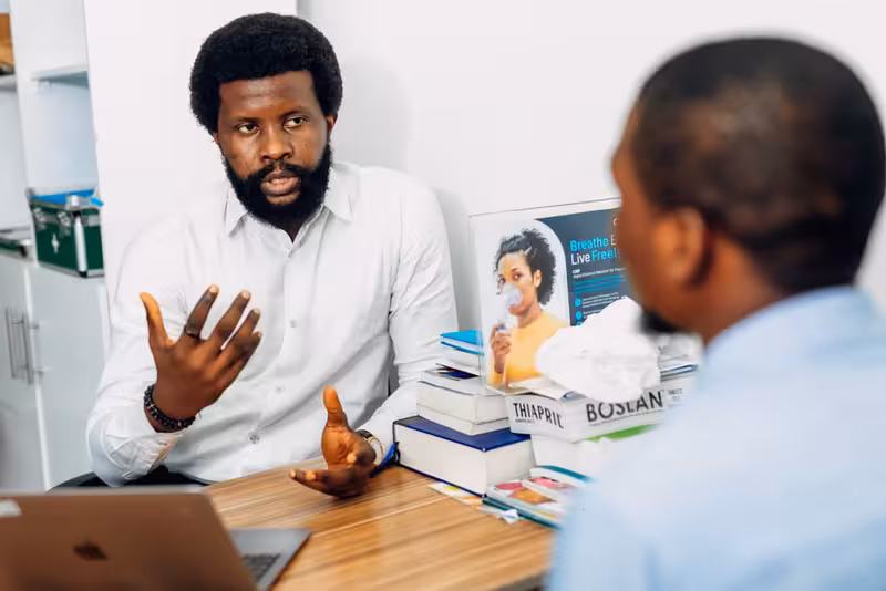 How to Prepare for Your First Visit After Registration: A doctor in a clinic Doctor in clinic for How to Prepare for Your First Visit After Registration - How To Register With Hearing First Ashford